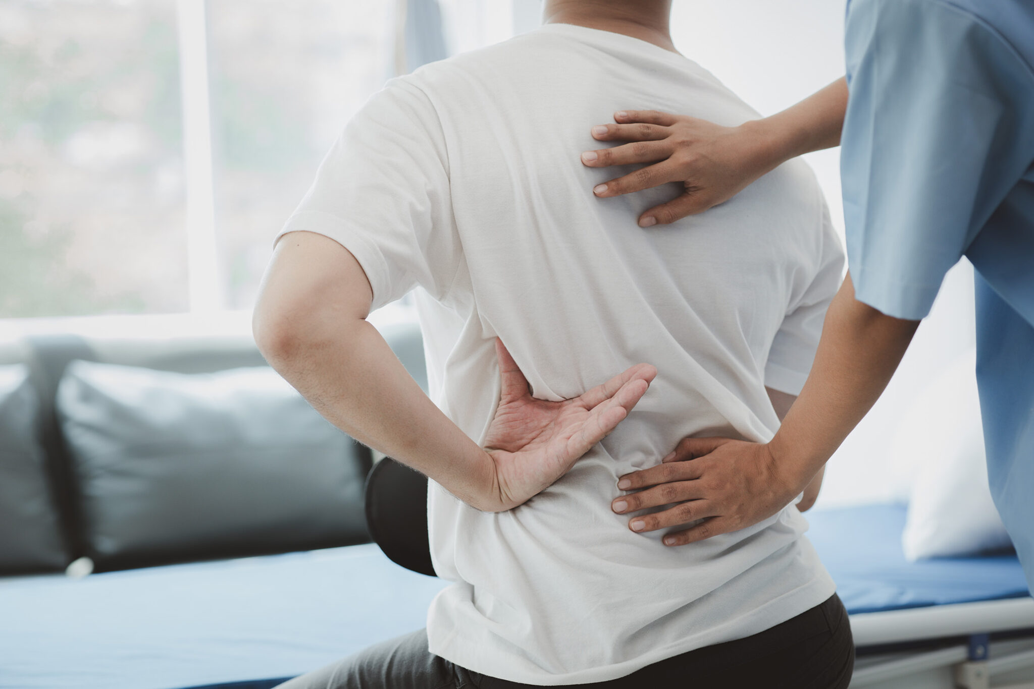 A physiotherapist doing physiotherapy for a patient